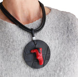 Black disk with coral stone