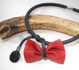 Eccentric contemporary necklace with red bow