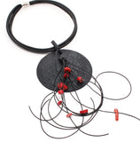 Black disk necklace with coral nuggets