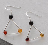 triangle-shaped earring with amber beads.