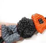 Long sculptural necklace with chunky color block pendant