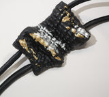 Long black necklace with gold and silver accents