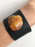  Black Leather cuff with Amber stone on a wrist