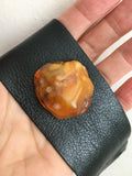 Black Leather cuff with Amber stone on a palm