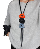 Long sculptural necklace with chunky color block pendant