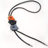 Long sculptural necklace with chunky color block pendant