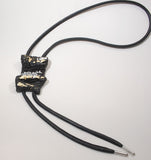 Long black necklace with gold and silver accents