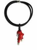 Necklace with a red  coral pendant and black cord on a white background
