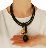Short geometric necklace with black and gold pendants