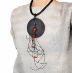 Black disk necklace with coral nuggets