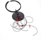 Black disk necklace with coral nuggets