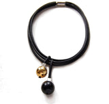 Short geometric necklace with black and gold pendants